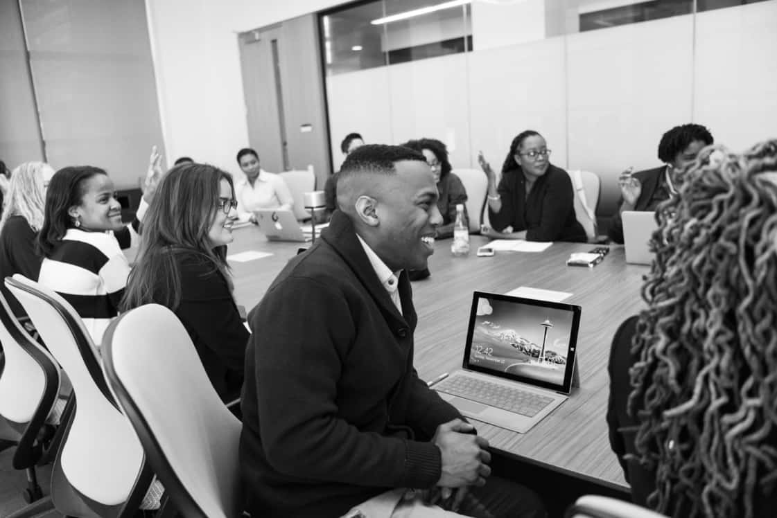 people sitting at a table at a business meeting